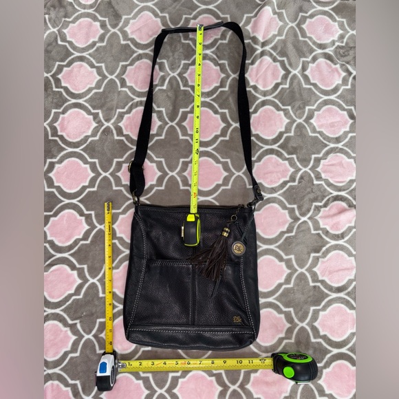 The Sak Black Genuine Leather Tassel Crossbody with Peace Print Interior - Picture 8 of 9